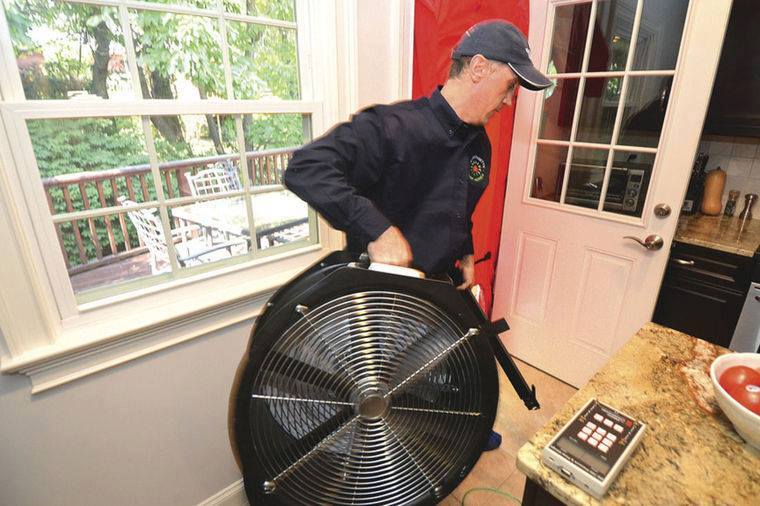 New England Smart Energy Group Worker Moving Fan At Work Site